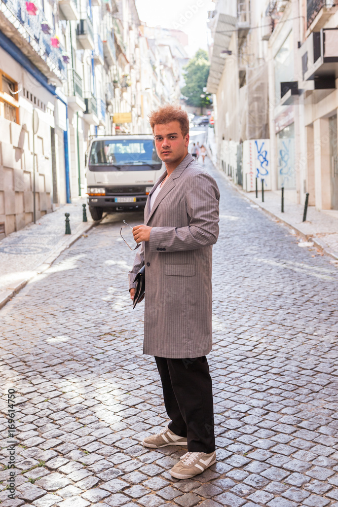 young fashion man on the street of European city