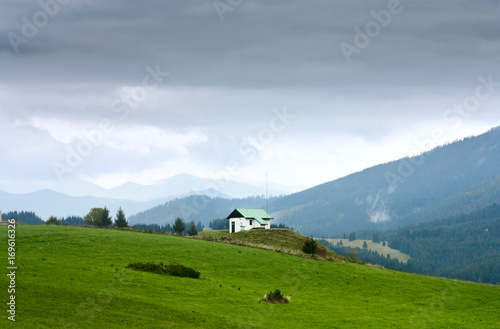 Summertime rural landscape - view against the mountains Western Carpathians, district the village Pokryvac in the Slovakia