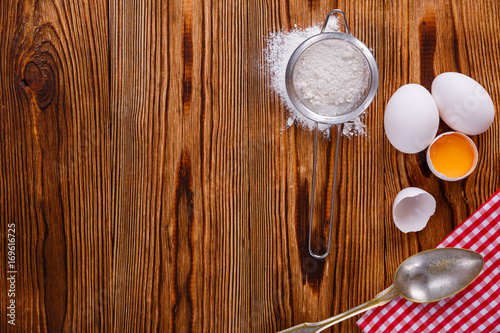 Baking background with eggshell. On wooden bakcgraund