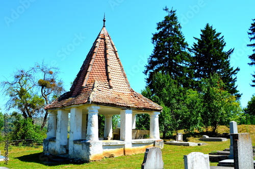 Cemetery. Fortified medieval saxon church in the village Merghindeal- Mergenthal, Transylvania,Romania. The settlement was for the first time certified in 1336 photo