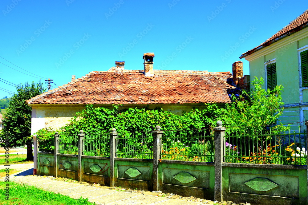 Typical rural landscape and peasant houses in the village Merghindeal ...
