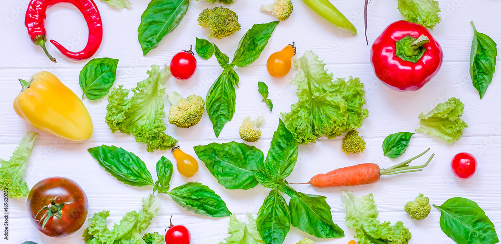 Collection of fresh organic vegetables and greeens on white wooden table. Top view. Healthy foods, cooking and vegetarian concept background. Selective focus, wide photo Collection of fresh organic vegetables and greeens on white wooden table. Top view. Healthy foods, cooking and vegetarian concept background. Selective focus, wide photo