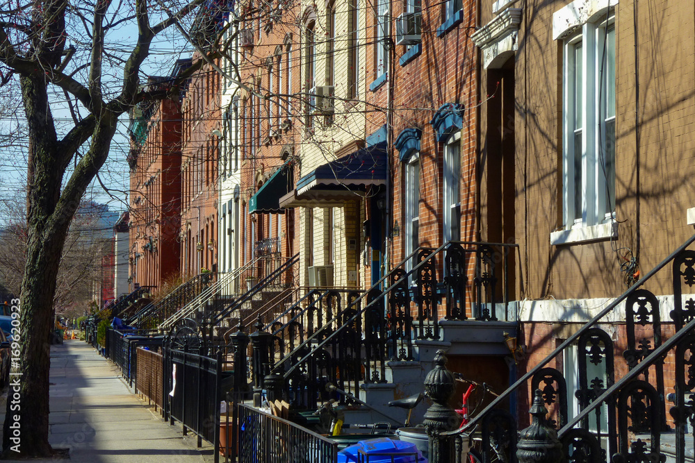 Row of houses and sidewalk in the city of Hoboken, New Jersey