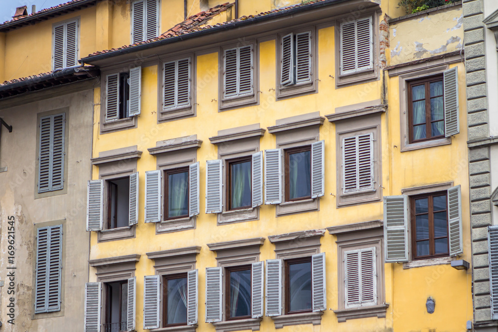 Old house with shutters in Florence, Italy