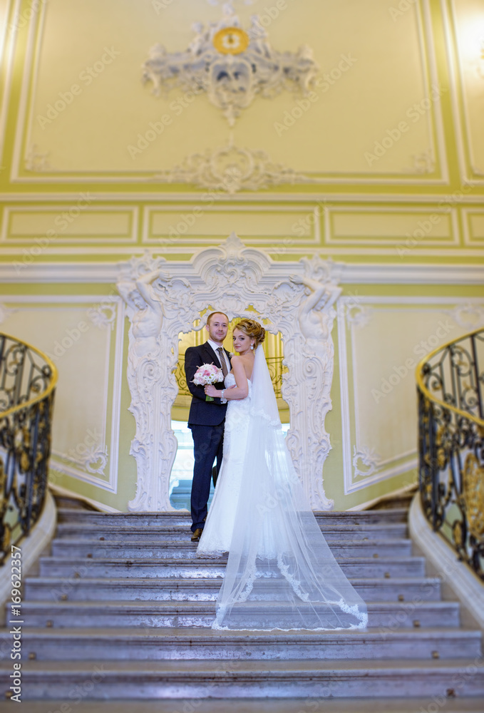 Wedding couple indoors is hugging each other Wedding couple indoors is hugging each other