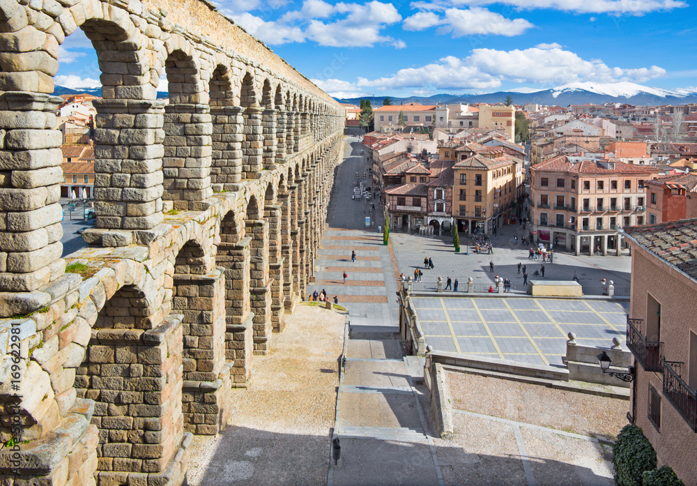 SEGOVIA, SPAIN, APRIL - 13, 2016: Aqueduct of Segovia and Plaza del Azoguejo with the town.