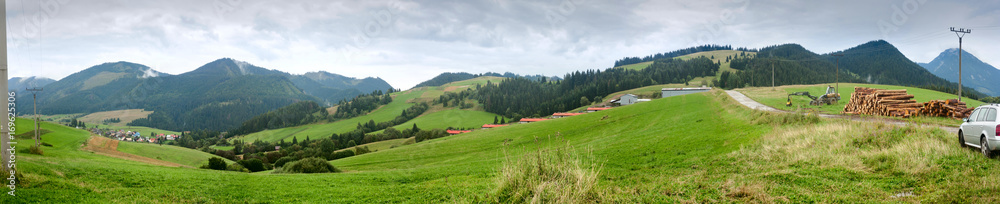 Summertime rural landscape banner, panorama with view against the mountains Western Carpathians, district the village Pokryvac in the Slovakia