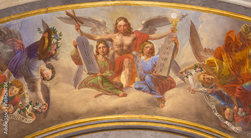 TURIN, ITALY - MARCH 13, 2017: The symbolic fresco of angels with the symbols of eucharist and Decalogue in Cattedrale di San Giovanni Battista by unknown artist of 19. cent. photo