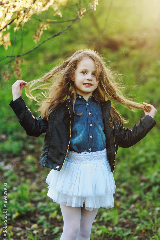 Fusion concept Closeup portrait of a cute little girl wearing leather  jacket denim shirt and white mini skirt Artsy grunge style Stock Photo   Adobe Stock