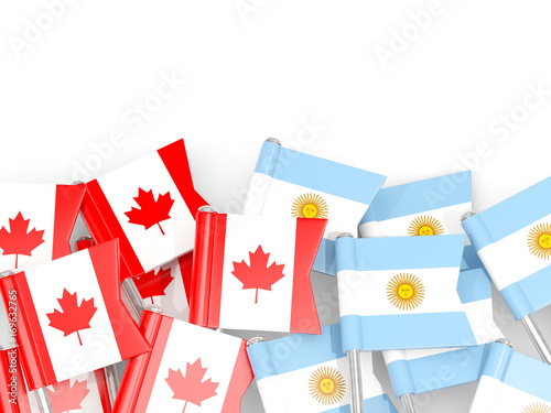 Flag pins of Canada and Argentina isolated on white