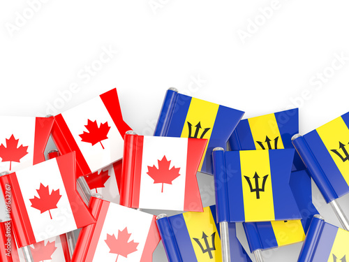 Flag pins of Canada and Barbados isolated on white