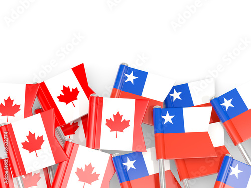 Flag pins of Canada and Chile isolated on white