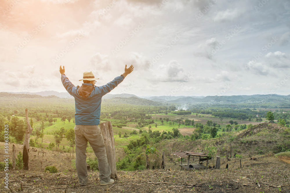 Man asian enjoying aerial view hands raised over clouds Travel Lifestyle Man asian enjoying aerial view hands raised over clouds Travel Lifestyle