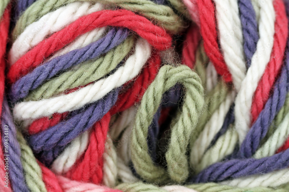 A super close up image of multicolored yarn 