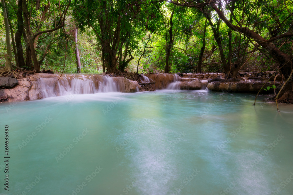 Waterfall in the jungle with lush greenery in the rainy season. Waterfall in the jungle with lush greenery in the rainy season.