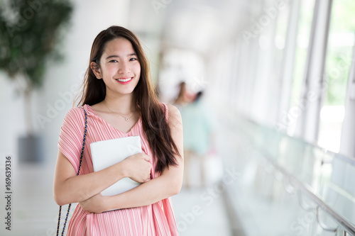Free Download Young asian lady relax in city center - GFXLoad