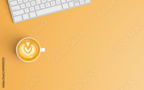 Modern workspace with coffee cup and keyboard copy space on orange color background. Top view. Flat lay style.