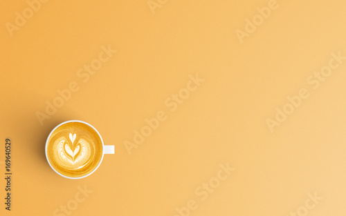 Modern workspace with coffee cup copy space on orange color background. Top view. Flat lay style.