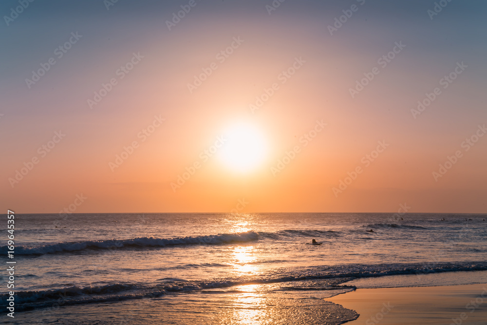 Water Sunset Background. Clear Tropical Island View and Sunset Beach Background. Sunset Waves and Amazing Landscape Ocean. Orange Ocean Beach. Sun rays in a Colorful Sunset Background. Beautiful Sky