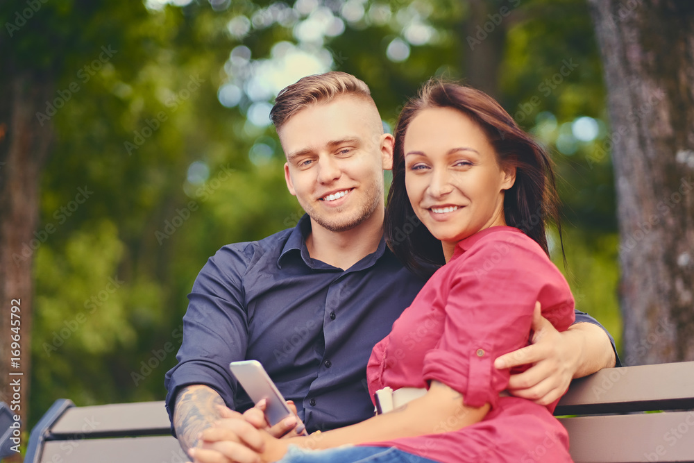 Fototapeta premium A couple using smartphone and instant messaging.