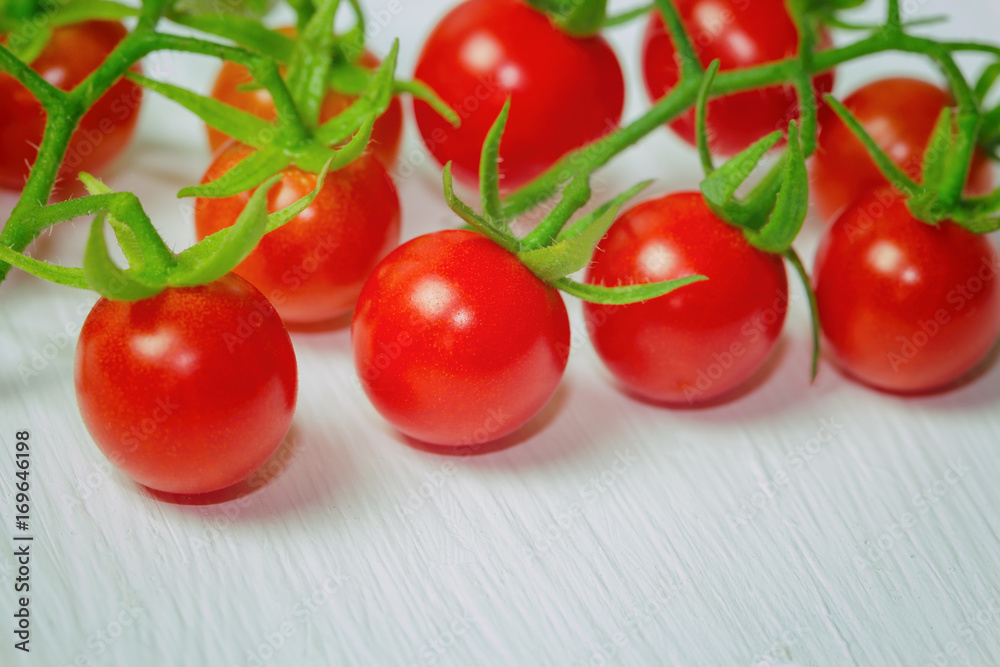 Fresh cherry tomato on rustic wood table. Close up lovely cherry tomato for background or wallpaper. Prepare fresh cherry tomato for home cooking look so delicious. Macro concept with copy space. Fresh cherry tomato on rustic wood table. Close up lovely cherry tomato for background or wallpaper. Prepare fresh cherry tomato for home cooking look so delicious. Macro concept with copy space.