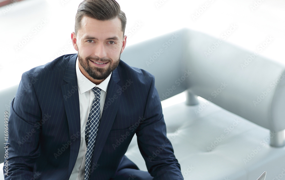 businessman working on a laptop with financial charts