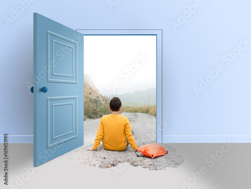 Room with open door. Teenager sitting on the road, outside and inside the house