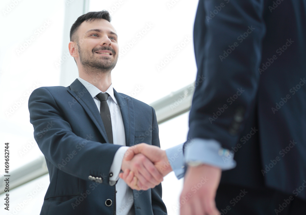 handshake of business partners after a favorable trade deal