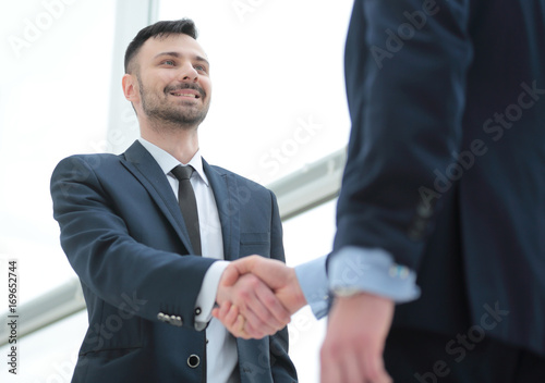handshake of business partners after a favorable trade deal © ASDF