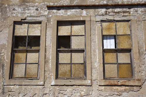 Windows on old building in Komiza, Croatia
