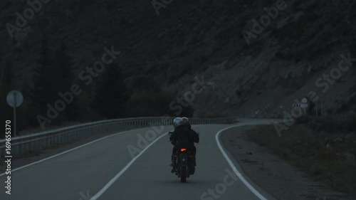 Couple of Motorcyclists are Driving along a Beautiful Serpantine Road