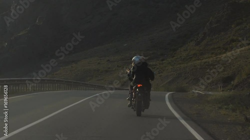 Couple of Motorcyclists are Driving along a Beautiful Road