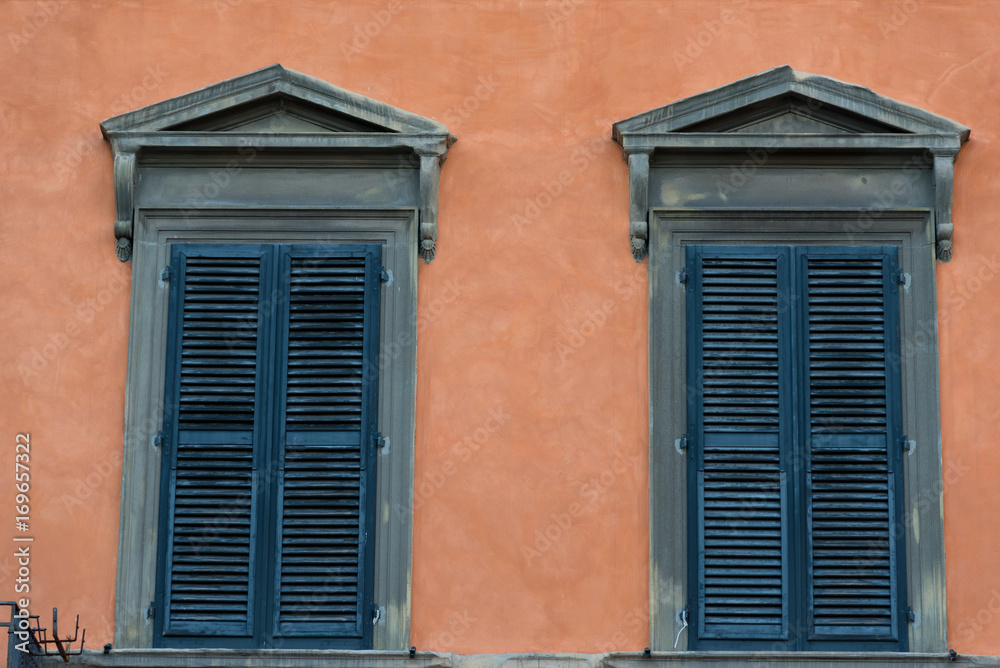 Details of the exterior of typical Italian buildings in Lucca, Tuscany, Italy.