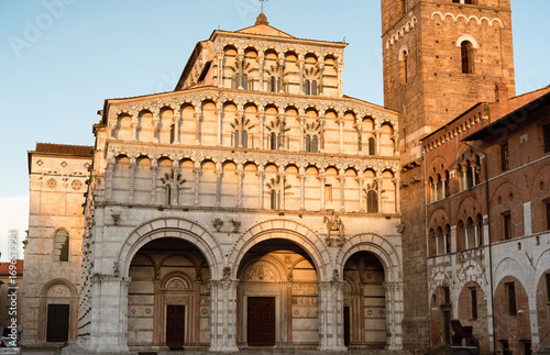 Romanesque Facade and bell tower of St. Martin Cathedral in Lucca, Tuscany. It contains most precious relic in Lucca, Holy Face of Lucca (Italian: Volto Santo di Lucca)