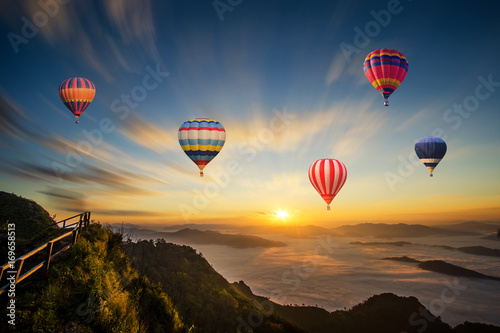 Colorful hot-air balloon flying over the mountain