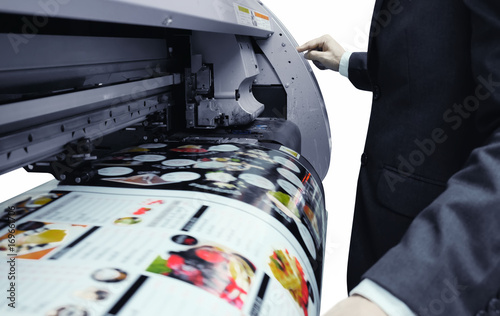 Businessman is using the printer