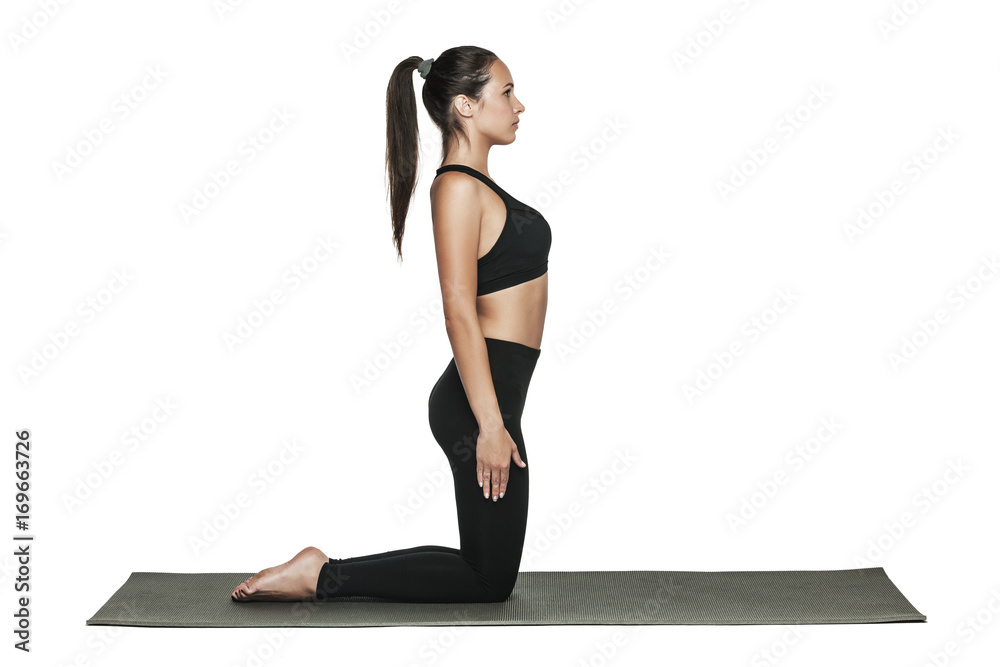 Woman exercising on yoga mat. Isolated on white. Woman exercising on yoga mat. Isolated on white.