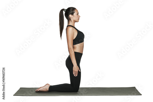 Wallpaper Mural Woman exercising on yoga mat. Isolated on white. Torontodigital.ca