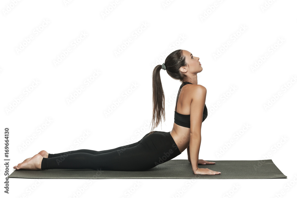 Woman doing yoga. Isolated on white.