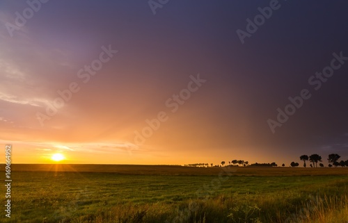 Beautiful sunset sky over meadows © milosz_g