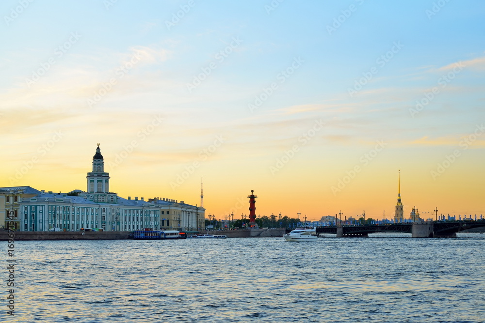 Sunset on the Neva river on the background of the Kunstkamera, the Peter and Paul fortress and Rostral columns