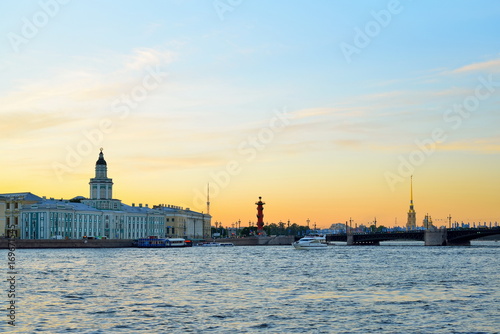 Sunset on the Neva river on the background of the Kunstkamera, the Peter and Paul fortress and Rostral columns
