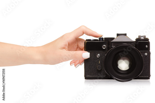 Female hand holding a camera