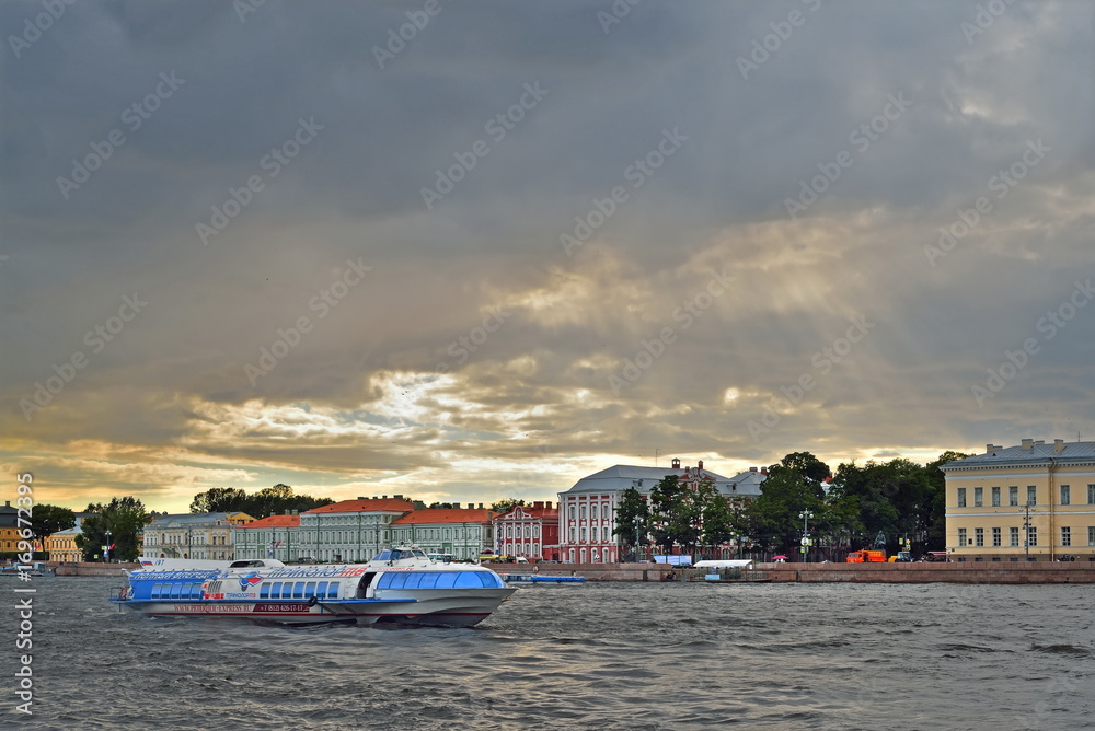 The ship hydrofoil floats on the Neva river on the background of the Menshikov Palace