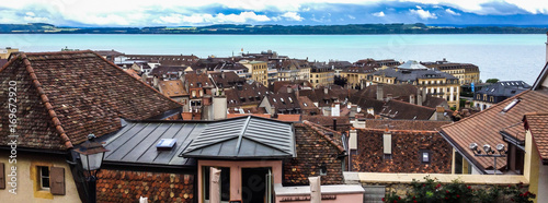 Top view of the medieval town Neuchatel with Lake Neuchatel and the Bernese Alps Chaumont seen on the horizon. photo