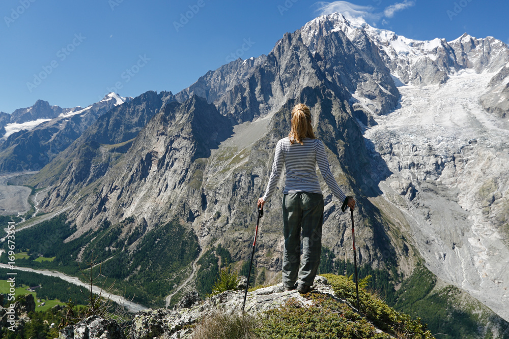 Hiker contemplates Mont Blanc