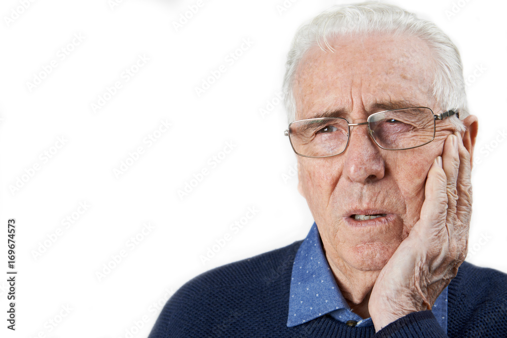 Studio Shot Of Senior Man Suffering With Toothache Studio Shot Of Senior Man Suffering With Toothache