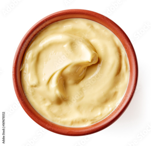 Mayonnaise in clay bowl isolated on white, from above