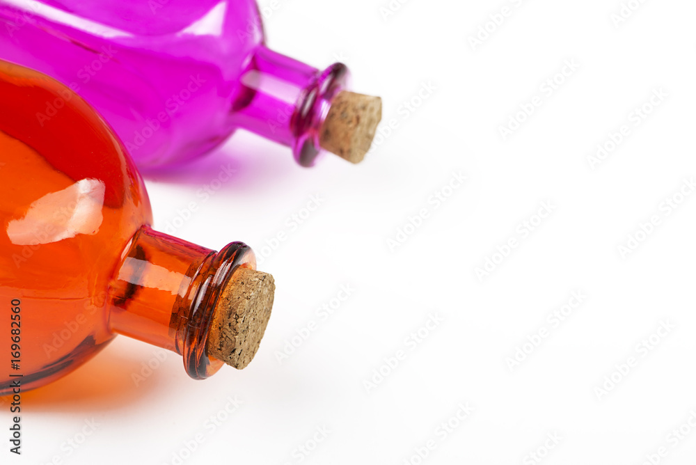 Close-up of lilac and orange glass jar on white background. Isolated. Container.