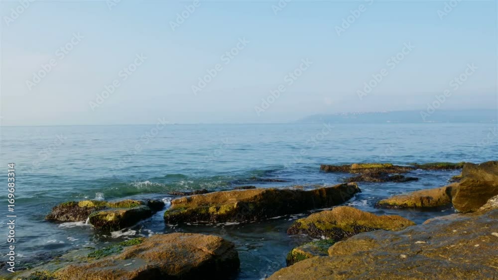 Stone Coast of the Black Sea, in summer, small waves. time lapse 4k Videos Stone Coast of the Black Sea, in summer, small waves. time lapse 4k Videos